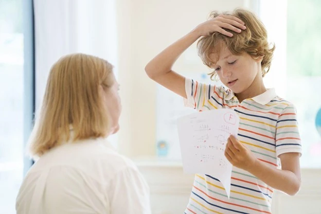Child shows parent an F grade